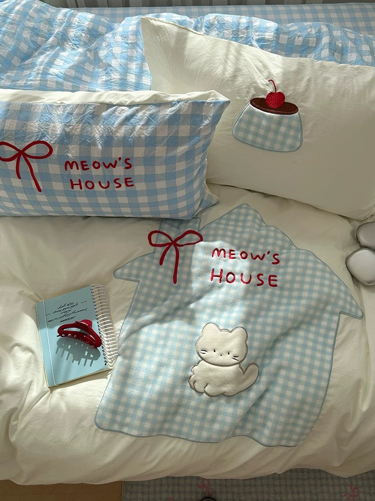 Cute blue bedding set for teen girls with cartoon cat design.