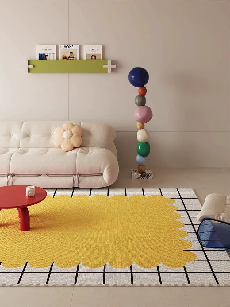 Modern living room with a yellow rug, white sofa, and colorful balloons.