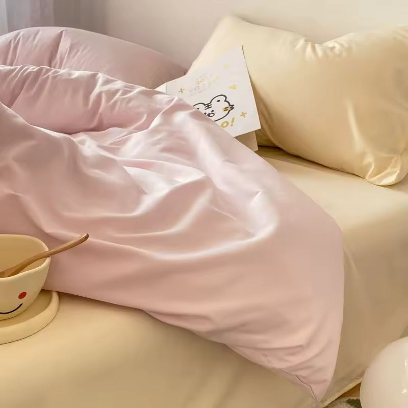 Pink pastel duvet cover and cream sheets styled in a cozy Pinterest-inspired bedroom.