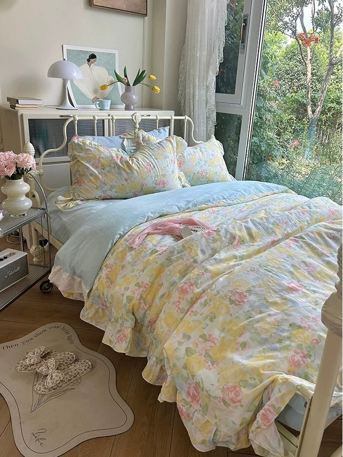Pastel floral bedding set photographed from the foot of the bed
