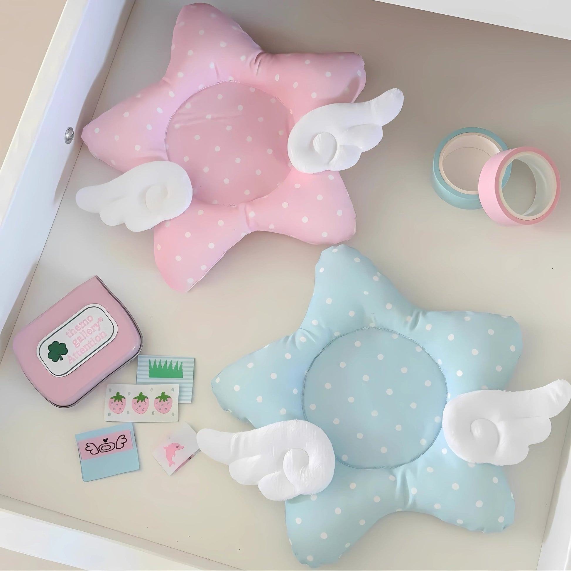 Pink pastel star-shaped kawaii coaster with angel wings and polka dots.