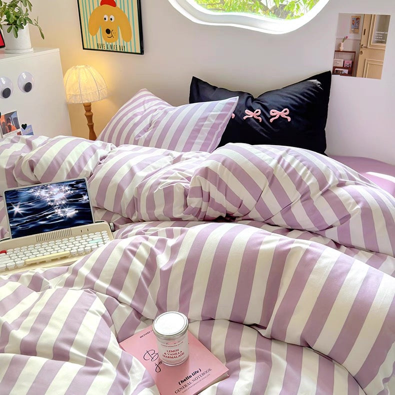 Korean minimalist room setup highlighting the lavender striped bedding on a low-profile bed frame