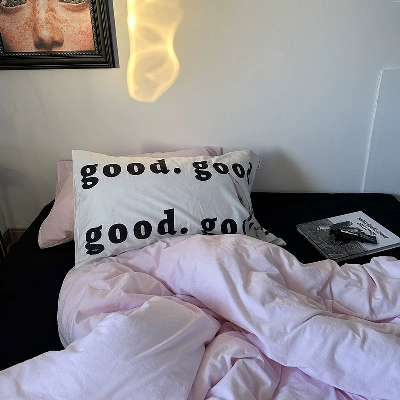 Pastel pink cotton bedding photographed in natural daylight.