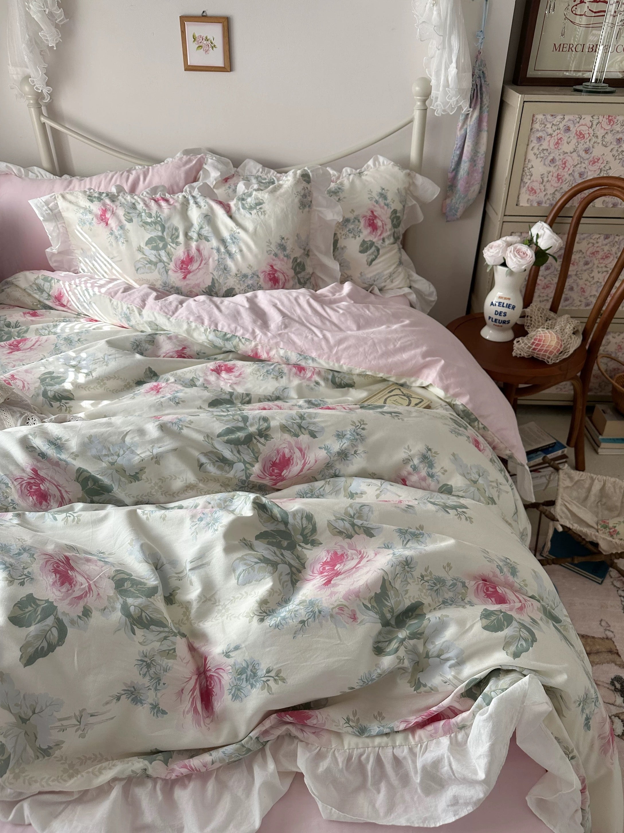Romantic cotton duvet cover with floral embroidery and ruffled pillow shams.
