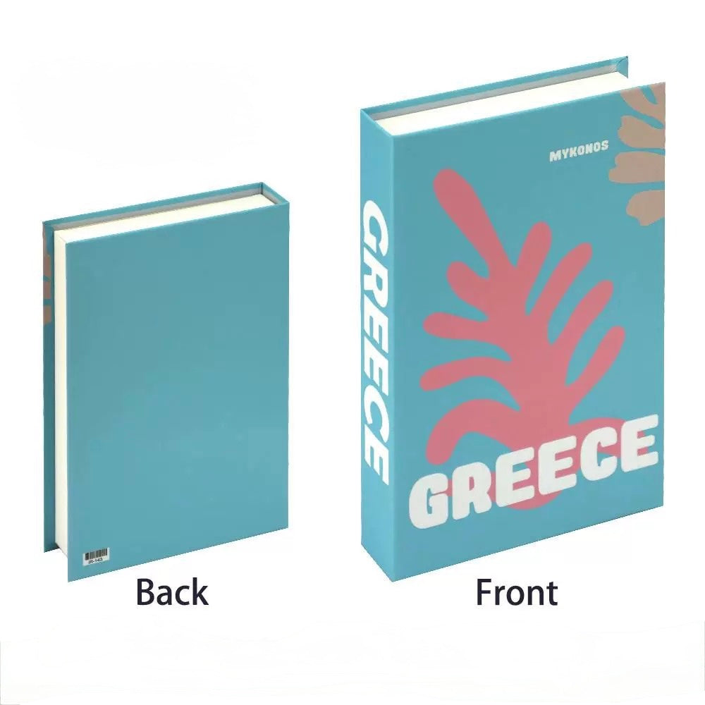 Flat lay of colorful book props arranged aesthetically on a desk with tulips and minimalist accents.