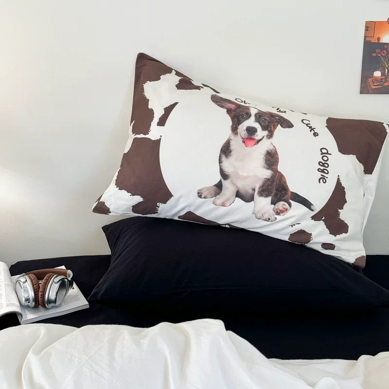 Cute dog print pillowcase with brown cow pattern and playful animal lover room styling.