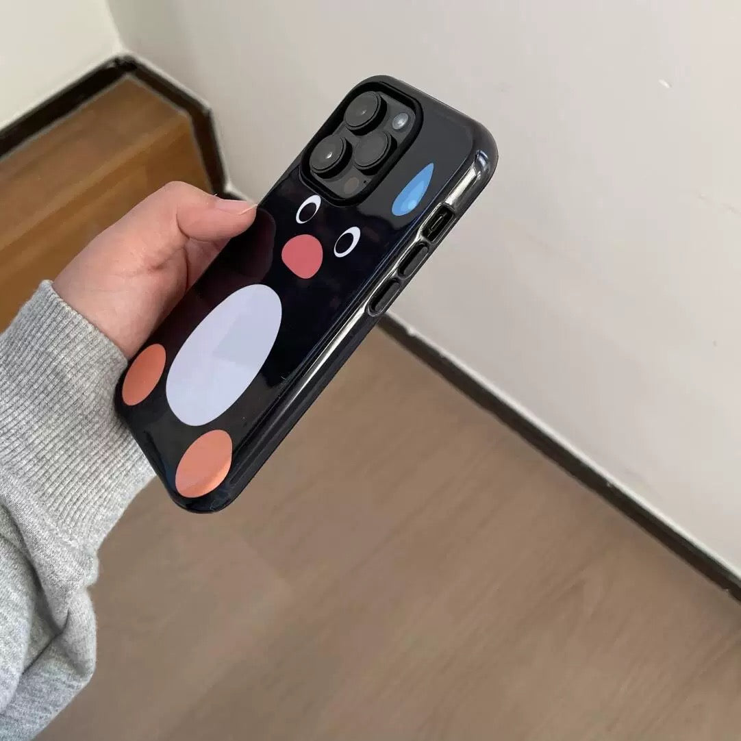 Phone case with cartoon face design held by a person