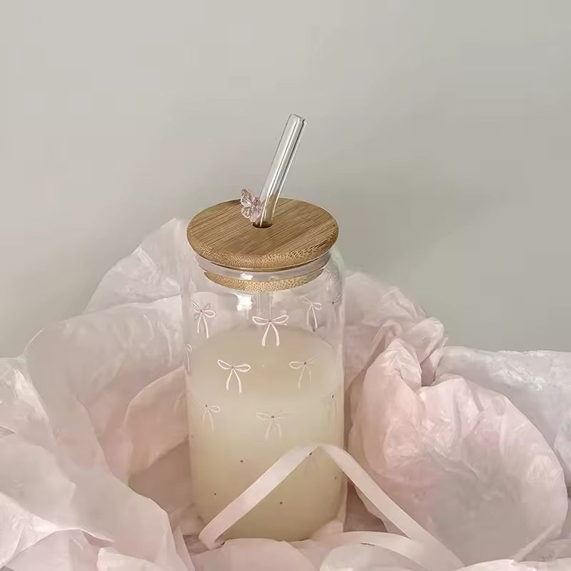 Coquette style glass tumbler with a delicate pink bow and ribbon detail, perfect for chic decor