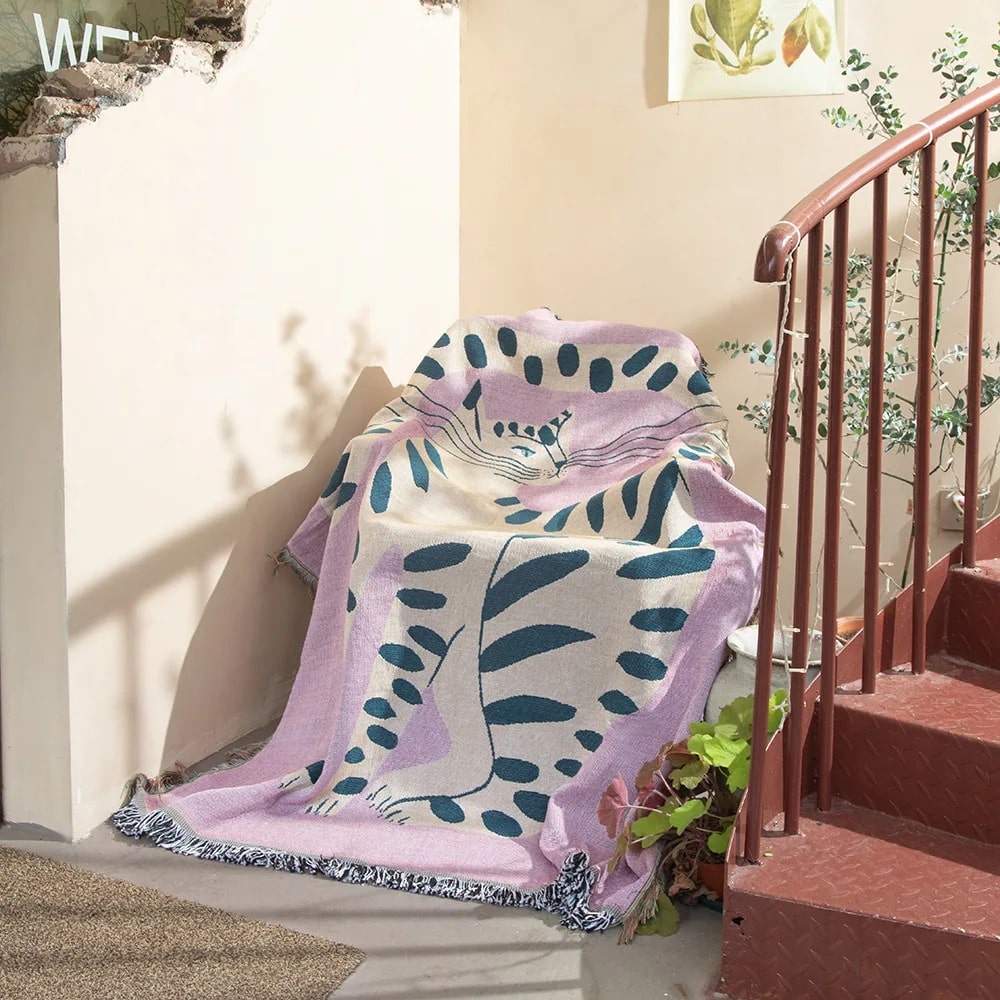 Chic Pink Cat Blanket on Sofa with Decorative Tassels