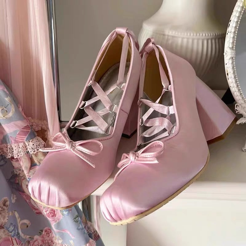 Elegant pink Lolita pumps for women, featuring a bow and lace-up closure