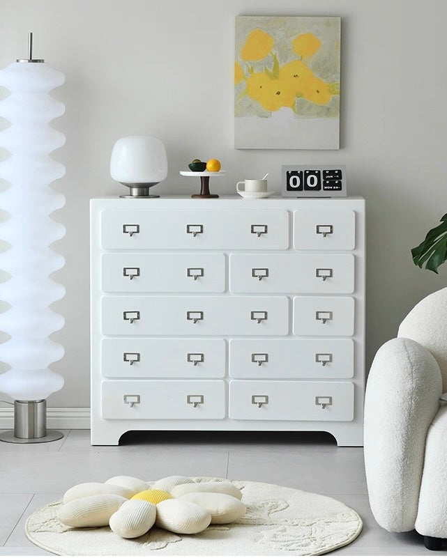 Pink dopamine ten drawer cabinet placed in small apartment room for storage