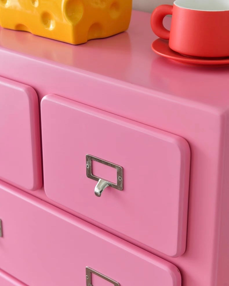 Pastel pink dopamine storage cabinet displayed in aesthetic living room interior space