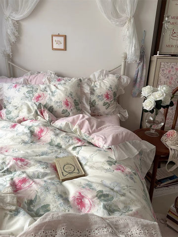 Pink floral ruffle bedding set styled in a cottagecore bedroom with lace curtains.