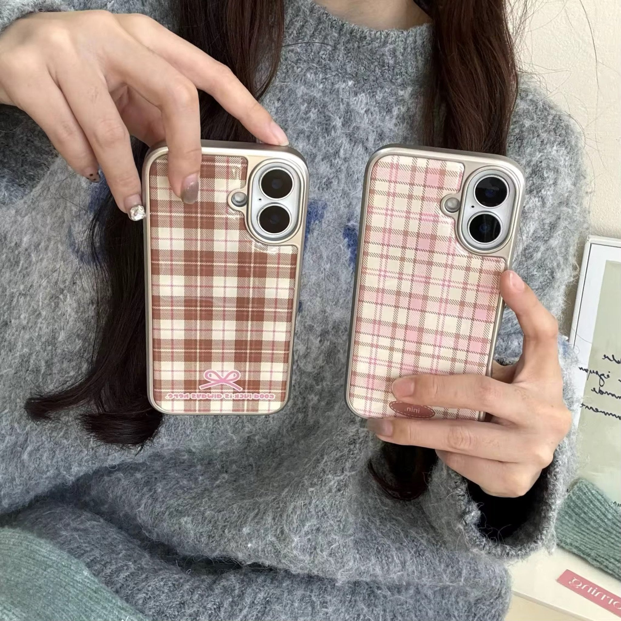 Retro checkered iPhone case shown in a cozy winter setup with gloves and slippers