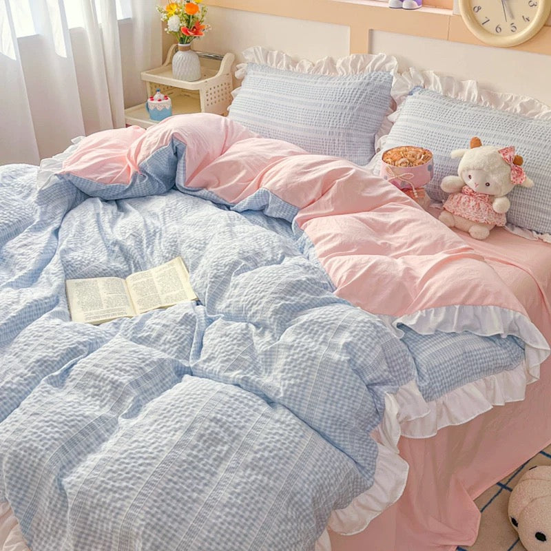 Pink phone case with a checkered pattern held by a person, with a magazine underneath.