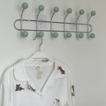 Multi-functional wall hook for hanging towels and backpacks