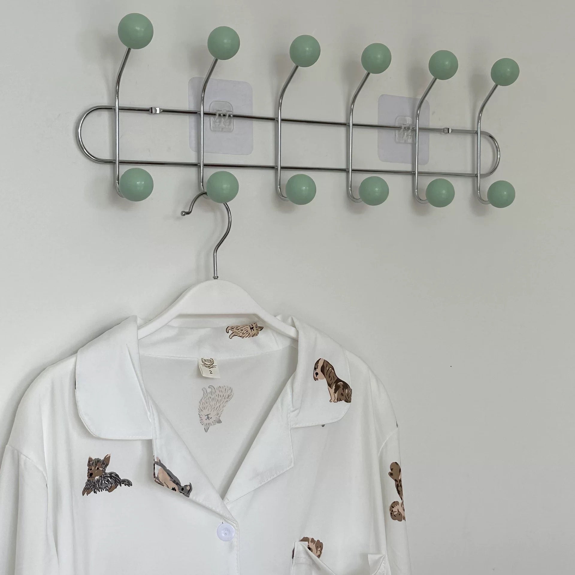 Multi-functional wall hook for hanging towels and backpacks