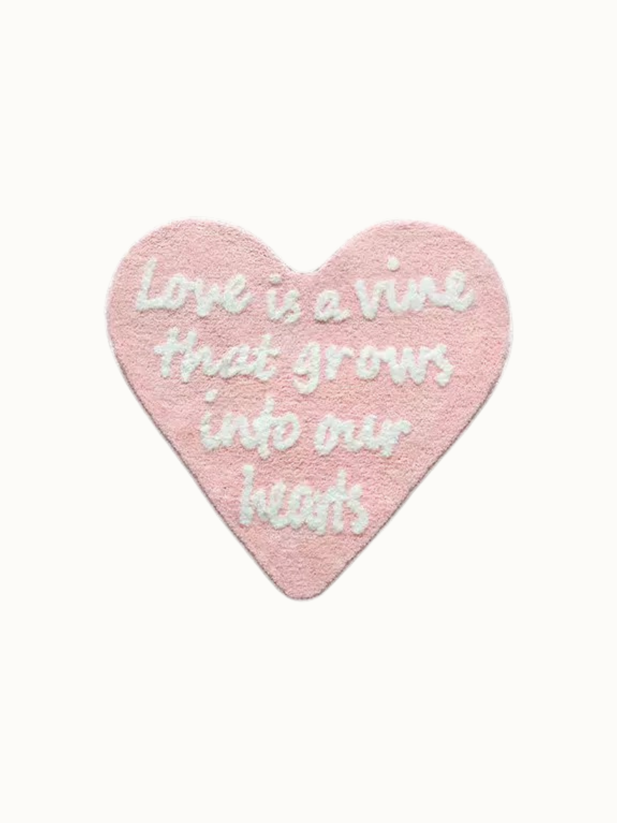 Pink and white Coquette rug shown against a plain background, with love lettering inside the heart outline.