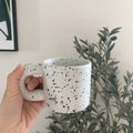 Stylish ink splatter mug for modern kitchen