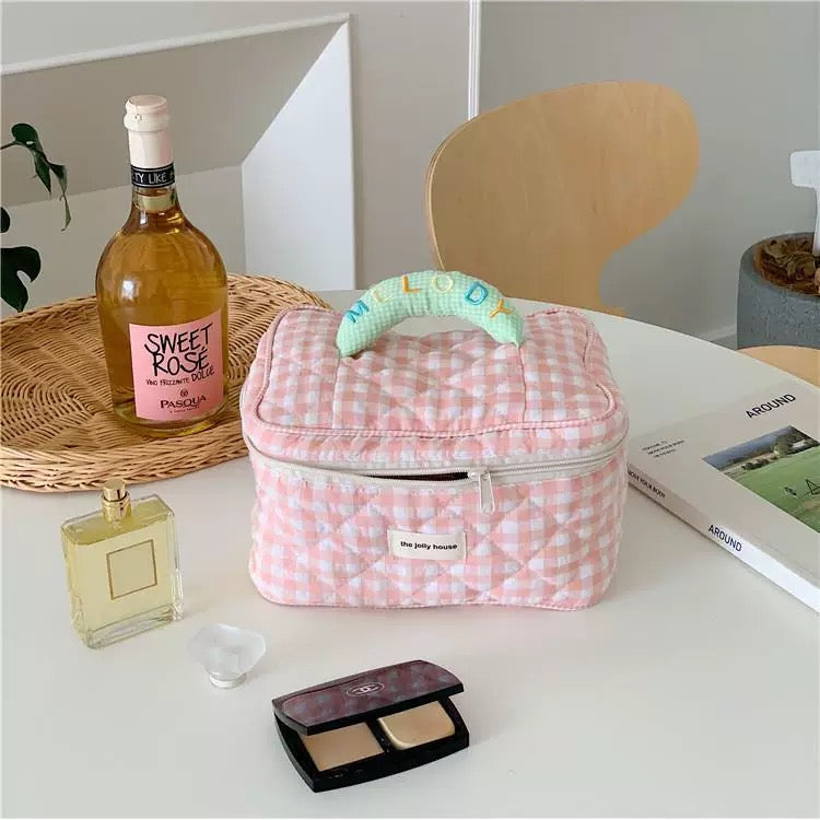 Chic plaid cosmetic bag with large capacity and pastel design, perfect for travel