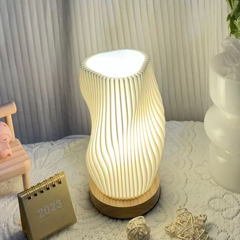 Pleated 3D printed desk lamp with USB charging and touch dimming. Modern wooden holder lamp for bedside and bedroom decor.