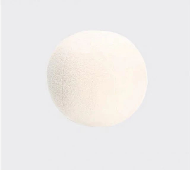 Minimalist round pillow in white boucle for living room decor