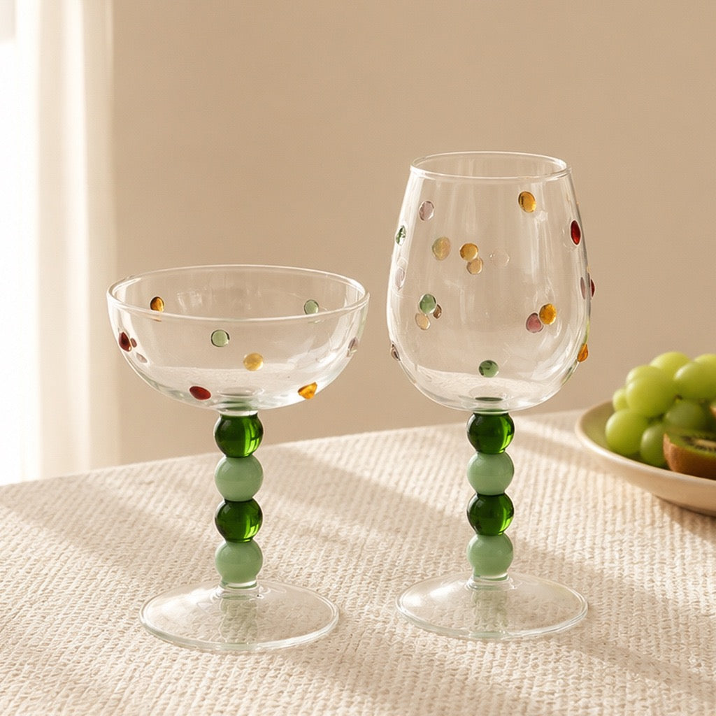 Polka dot wine glasses with stacked green ball stems and clear glass bowls