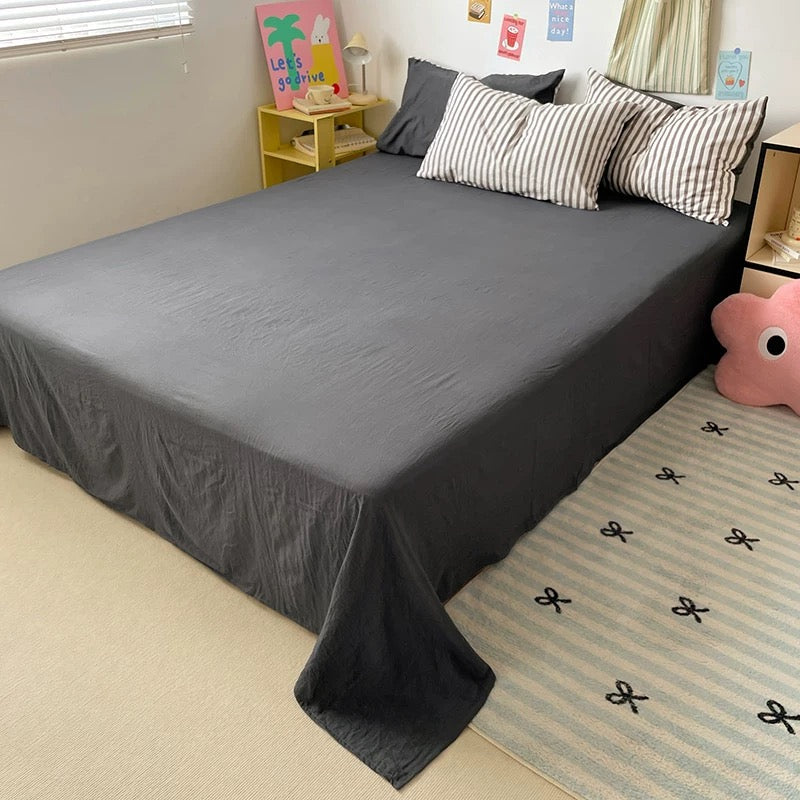 Black stripe bedding set for queen bed, showing duvet cover and solid black sheet