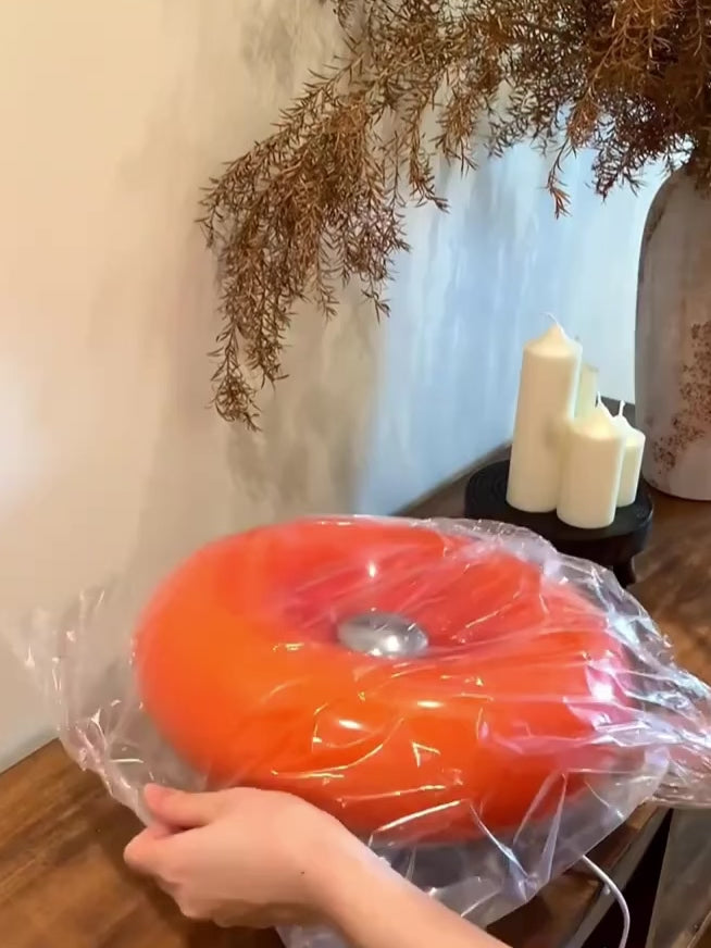 Retro orange Bauhaus lamp with donut-shaped glass design