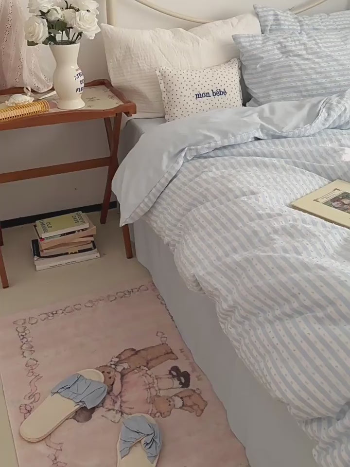 Blue and white stripes with a woven texture you can feel. Washed cotton that lightens a dark room and softens with every wash. Twin to King.