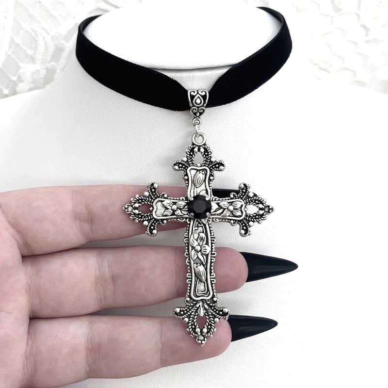 Gothic black velvet choker with crystal cross pendant. Stylish necklace for women and men with punk and baroque aesthetics.