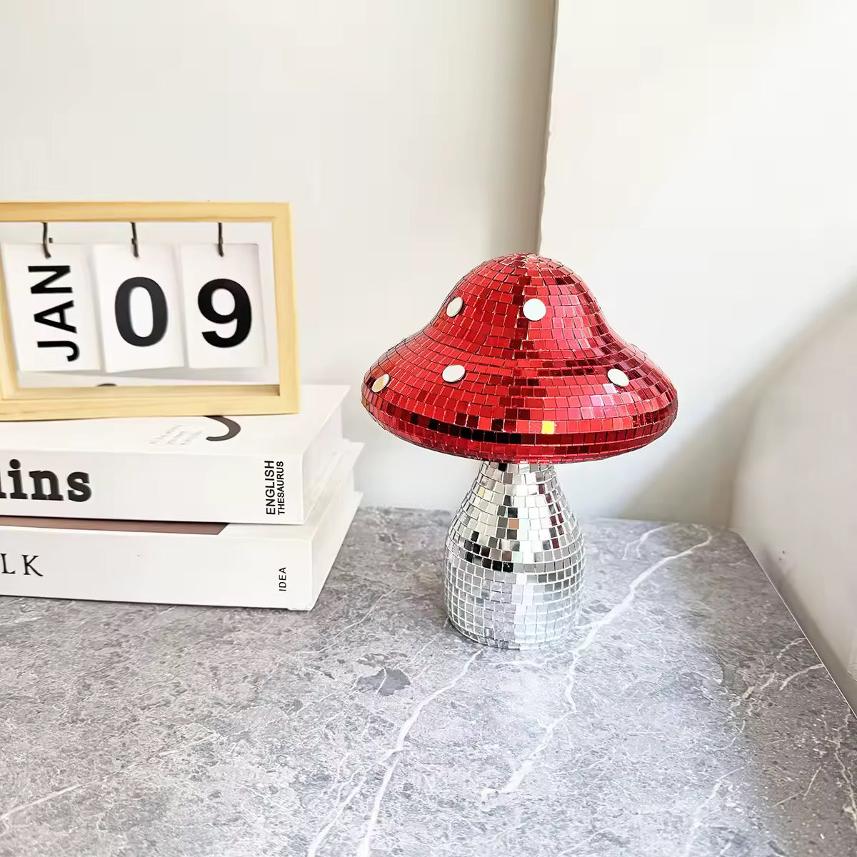 Reflective mushroom ornament on a Y2K pink table setting