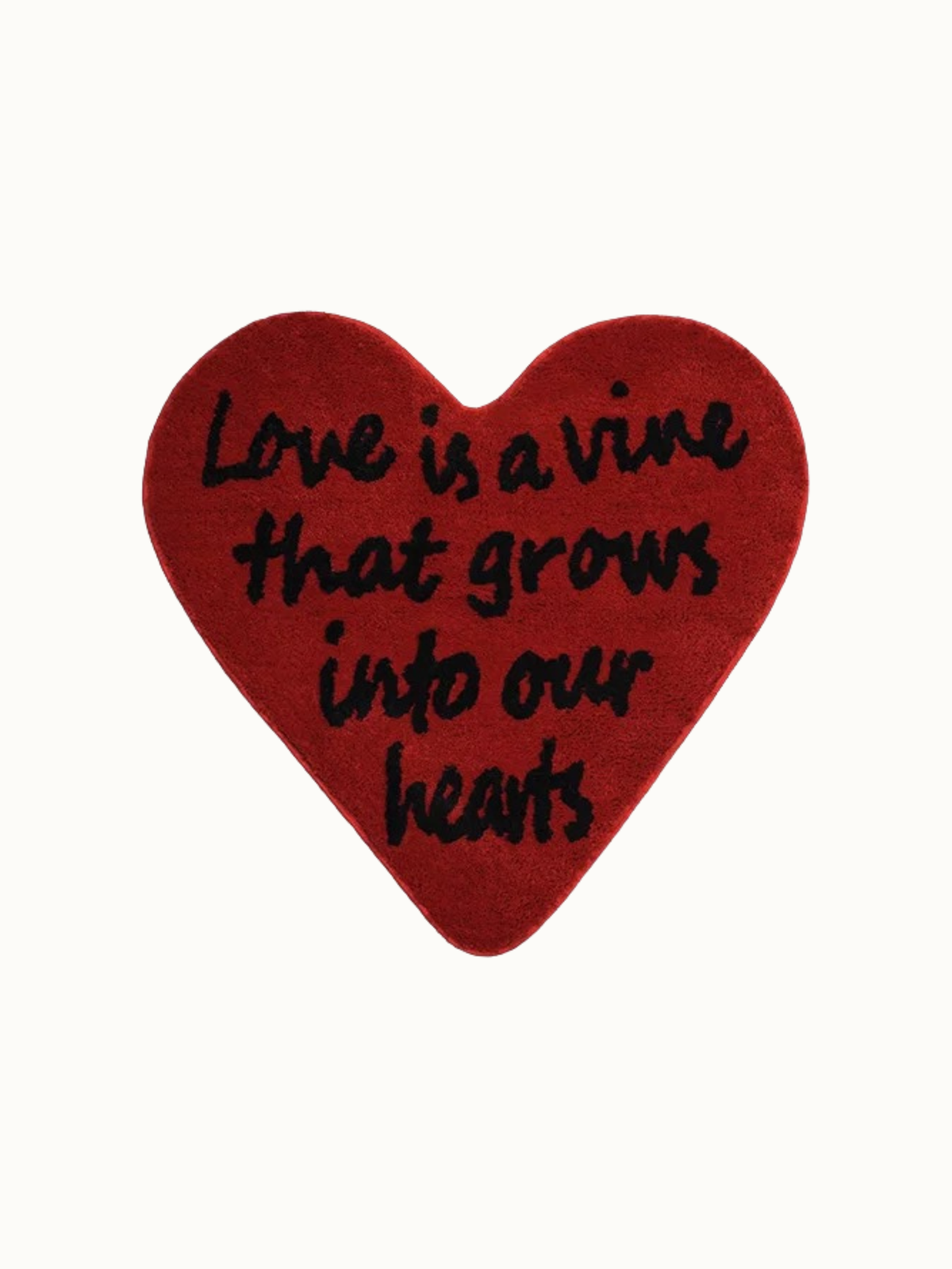 Red heart rug shown against a plain background, with black script arranged from its rounded top to the point.