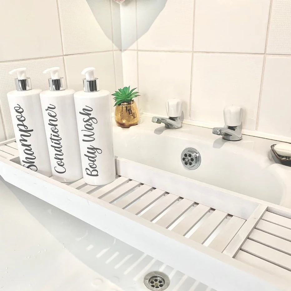 Refillable shower shampoo and conditioner bottles for bathroom use. Modern farmhouse style with durable 500ml plastic containers and wood pumps.