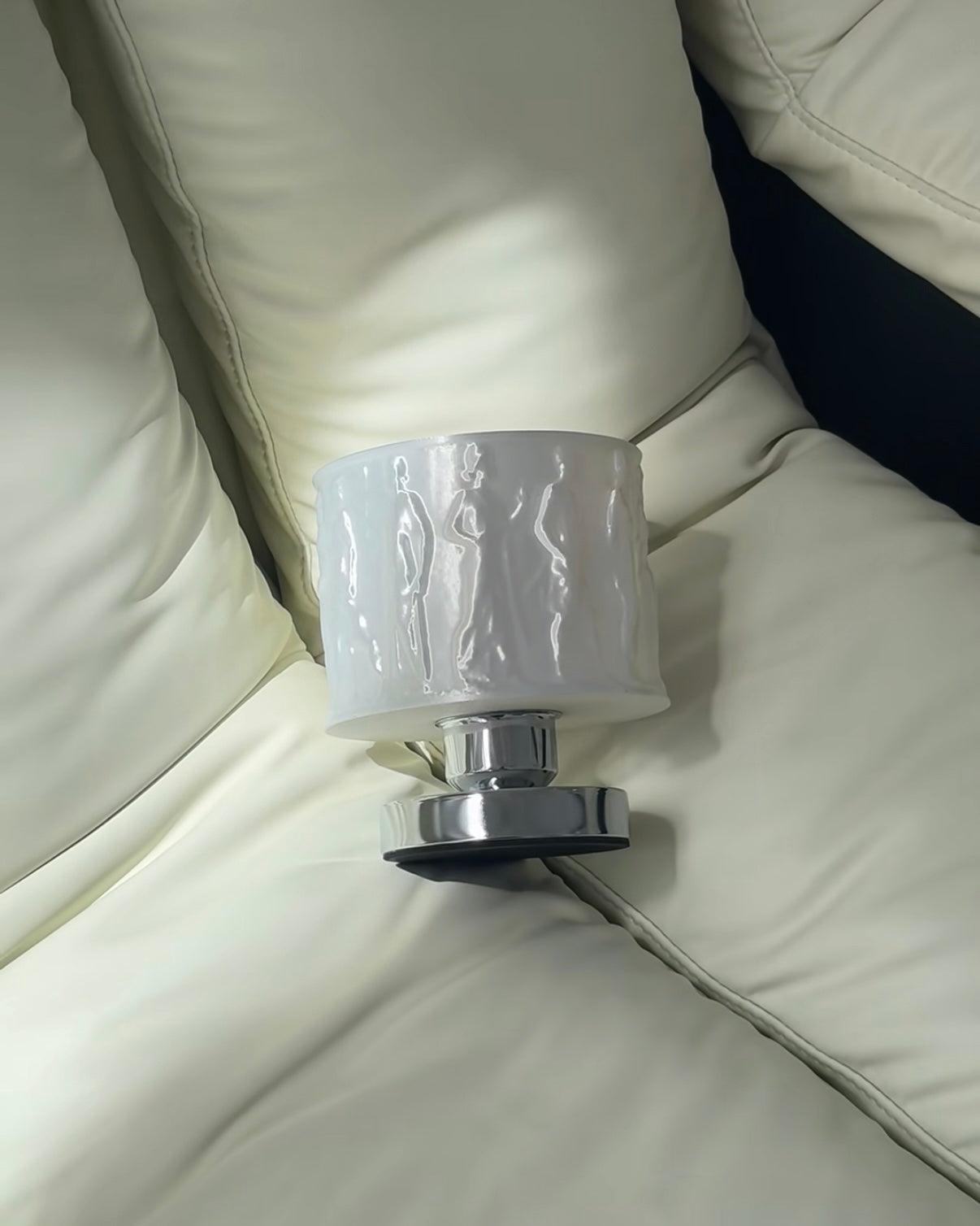 Relief art table lamp with sculptural shade creating soft ambient bedroom lighting for modern interiors
