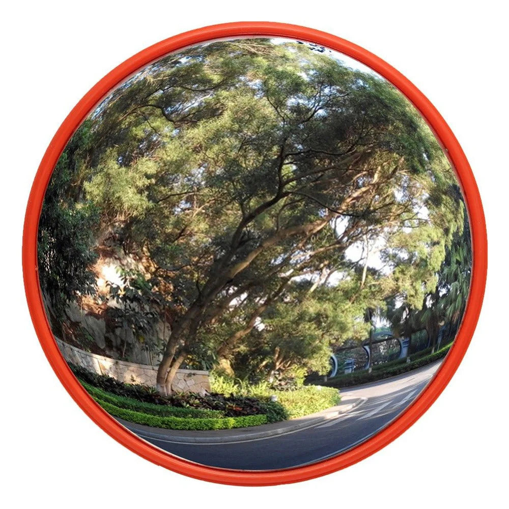 Convex mirror reflecting a tree-lined street