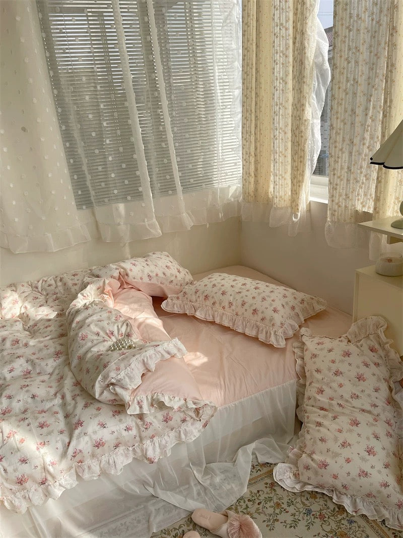 Teen bedroom styled with floral lace bedding and pearl heart accent