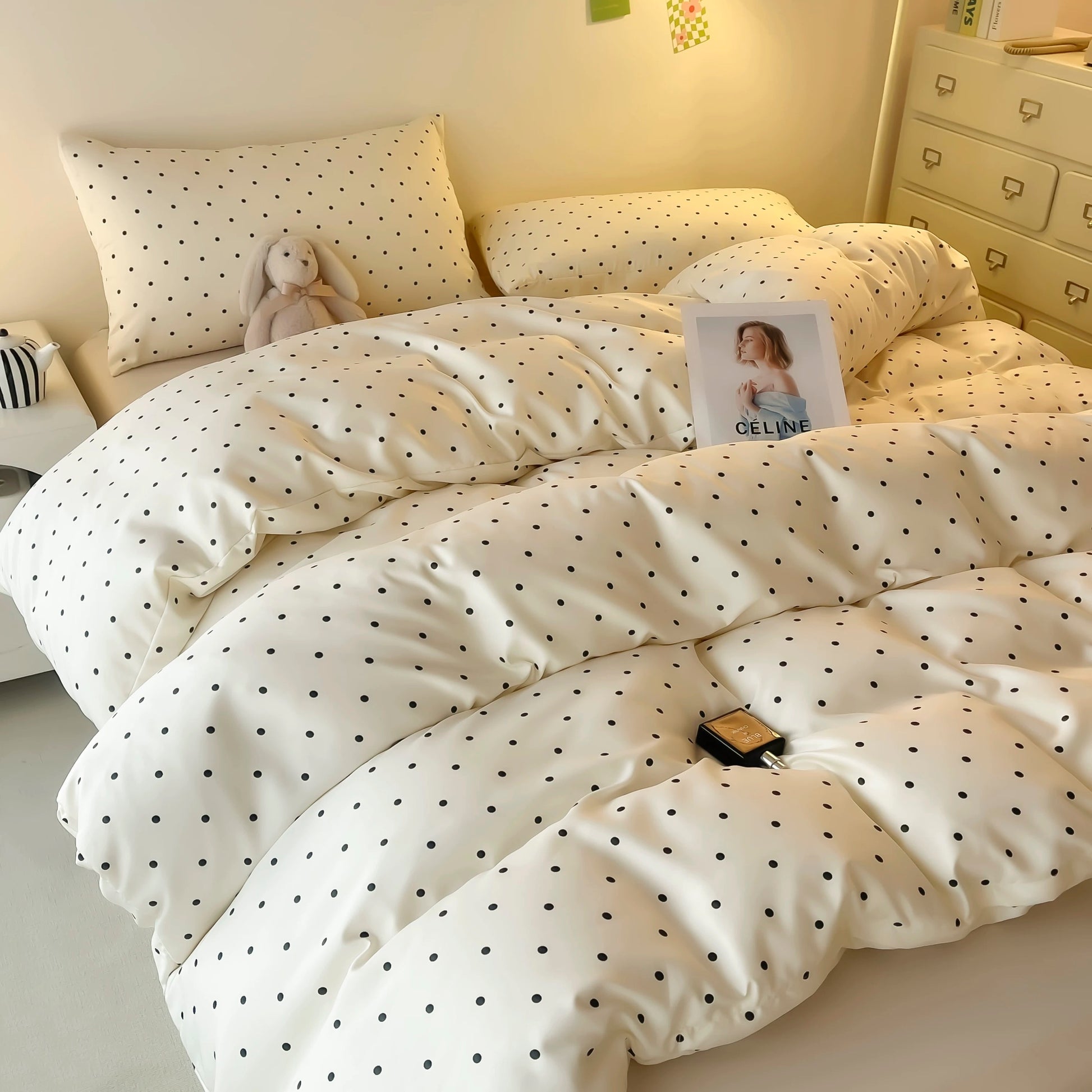 Preppy dorm bedding polka dot satin duvet styled with modern furniture.