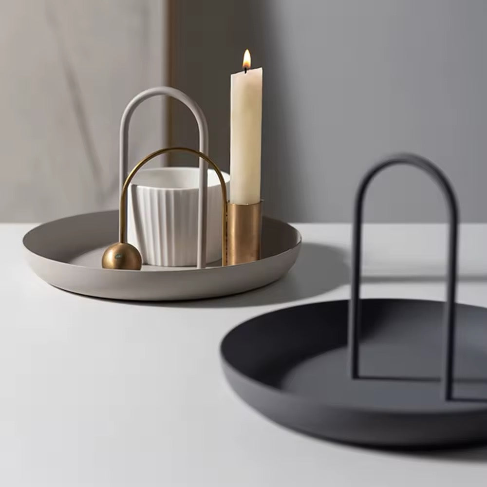 The tray on a coffee table, holding decorative items and enhancing the room's aesthetic.