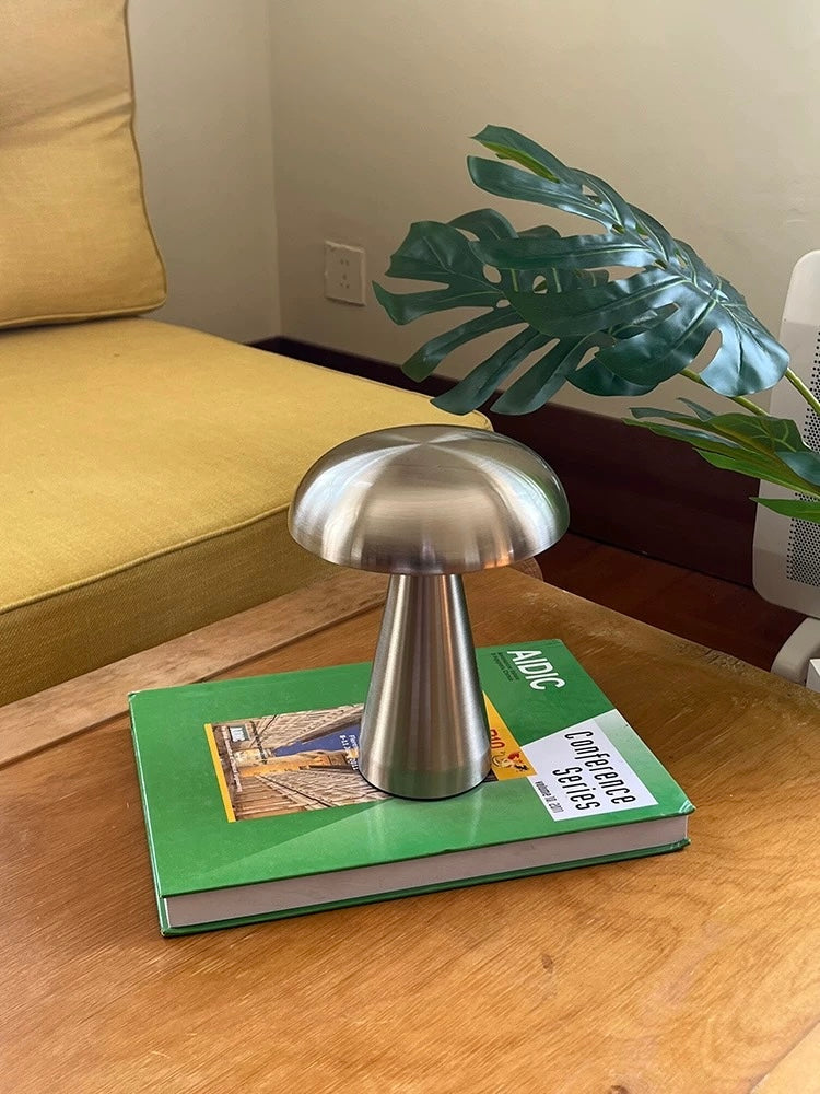 Touch sensor lamp glowing in a cozy small bedroom setup