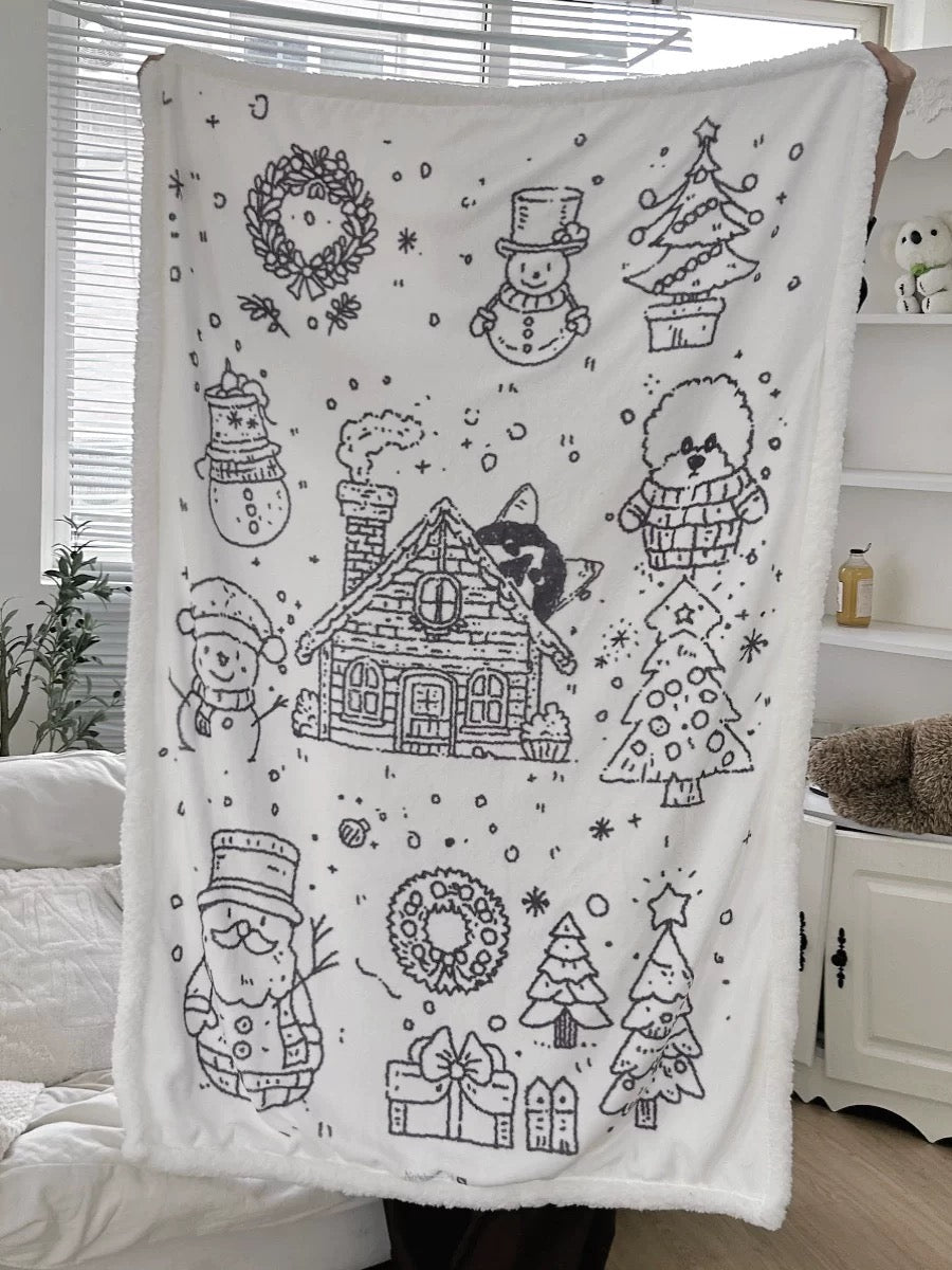 Snowy Christmas fleece throw blanket styled across white bedding in a bright bedroom