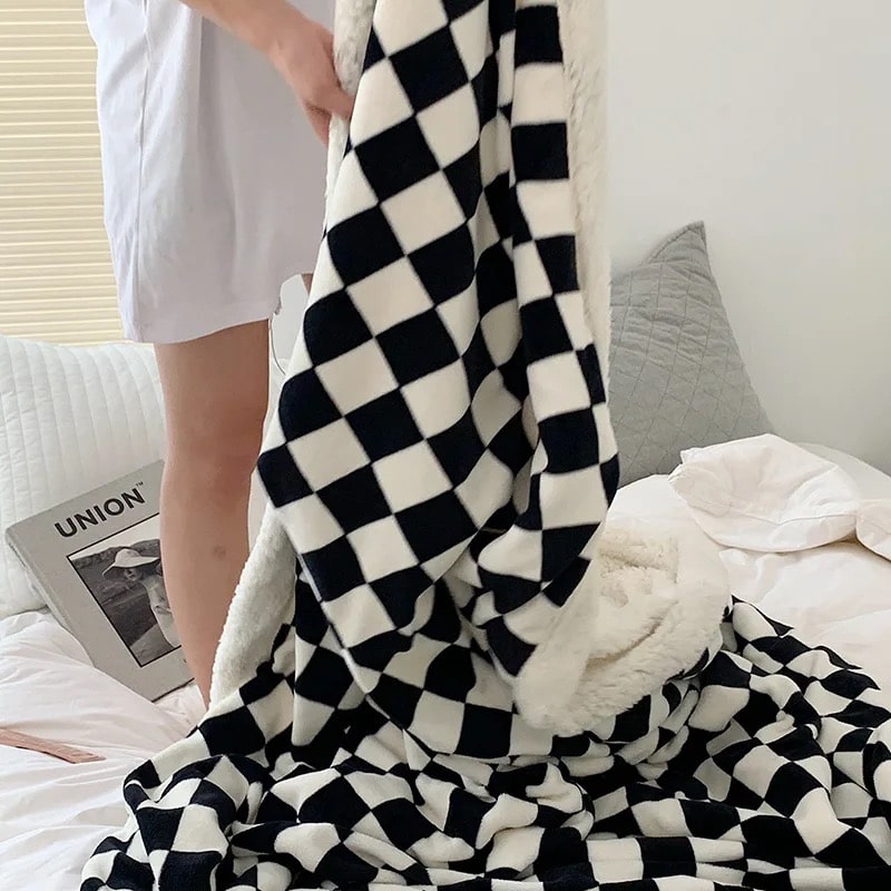 Soft reversible checkered throw for winter comfort