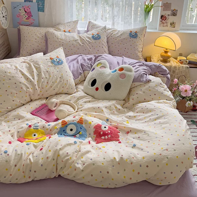 Pastel kawaii bedroom setup with colorful embroidered cotton bedding.