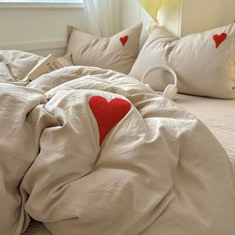 Aesthetic room decor featuring beige heart bedding and cozy dorm elements