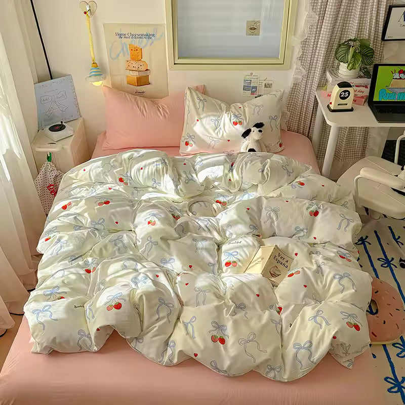 Kawaii cherry and bow duvet cover displayed in a pastel bedroom aesthetic setup.