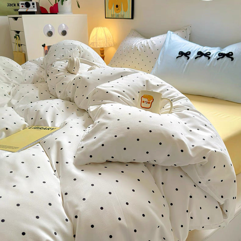 Aesthetic dorm setup featuring coquette bedding and pastel accents