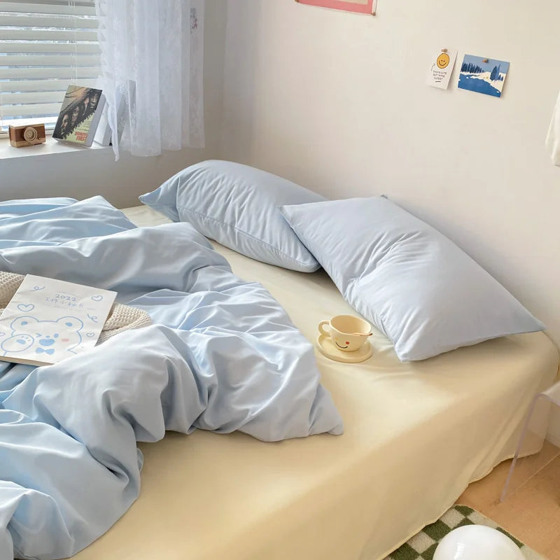 Aesthetic cream and blue bedding for dorm rooms and small bedrooms.
