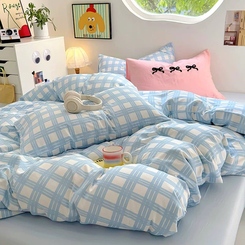 Full view of the 4-piece bedding set with plaid duvet and matching pillowcases in a coquette style room