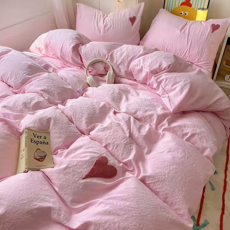 Pastel pink bedding set with cozy texture and delicate heart detail