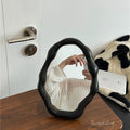 Funky pink wavy mirror ideal for small room decor